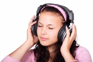 cute girl listening to binaural beats meditation